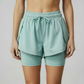 Short NØR Runner Mujer Unitalla Aqua